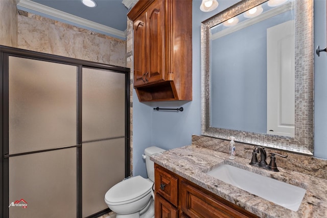 bathroom featuring toilet, vanity, ornamental molding, and walk in shower