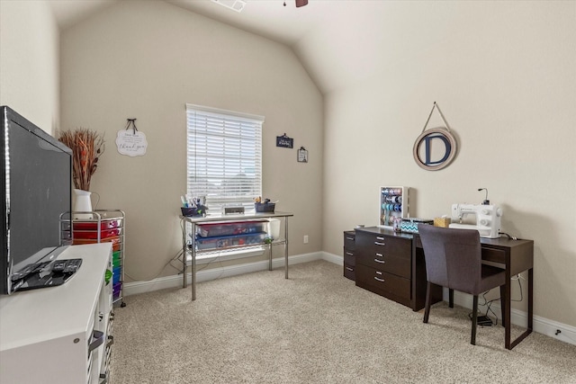 carpeted home office featuring vaulted ceiling and ceiling fan