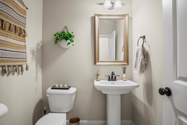 bathroom featuring sink and toilet