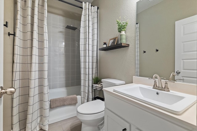 10012 Travis Dr, Providence Village, TX 76227 - bathroom with a textured wall, toilet, vanity, shower / tub combo, and tile patterned floors