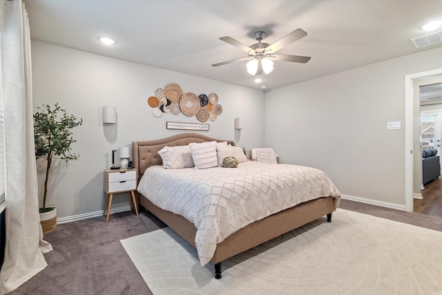 bedroom featuring dark carpet and ceiling fan