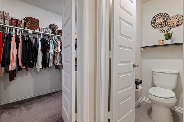 bathroom featuring tile patterned floors and toilet