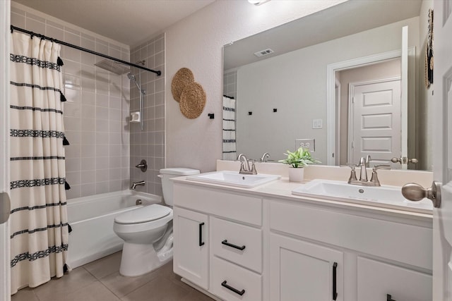 full bathroom with tile patterned floors, toilet, shower / bath combination with curtain, and vanity