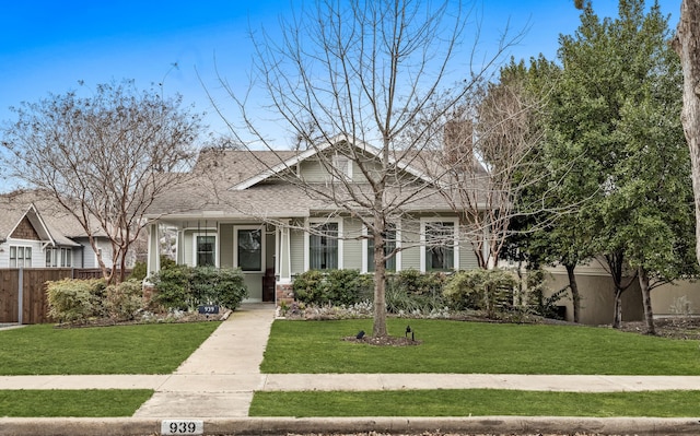 bungalow-style house with a front yard