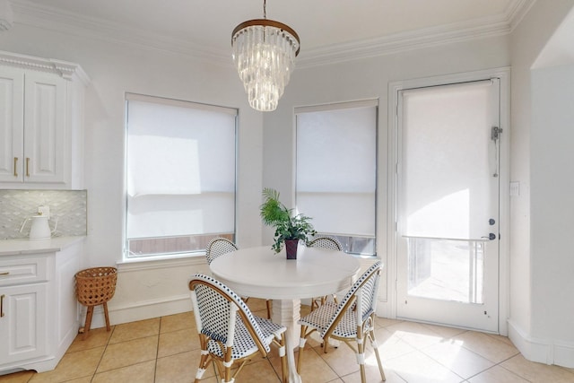788 Windsong Ln, Rockwall, TX 75032 - dining room featuring ornamental molding, light tile patterned floors, a chandelier, and baseboards