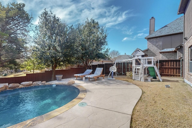 788 Windsong Ln, Rockwall, TX 75032 - view of pool featuring a fenced backyard, a playground, and a patio