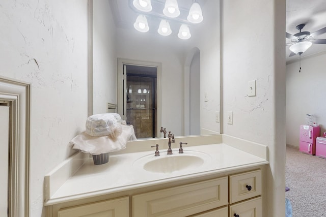 bathroom featuring ceiling fan and vanity