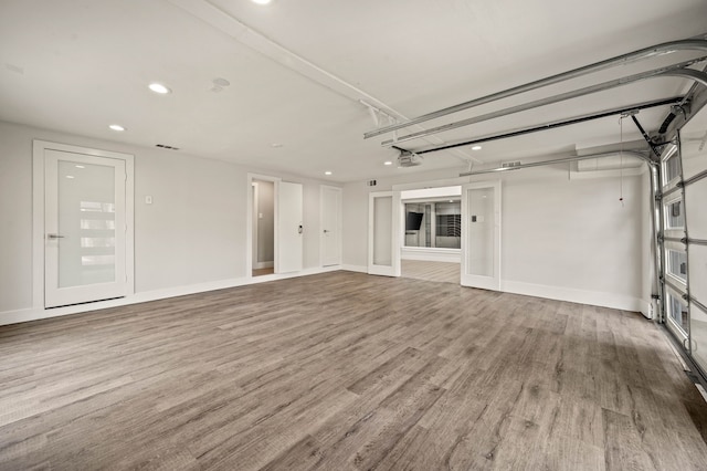 unfurnished living room with hardwood / wood-style flooring