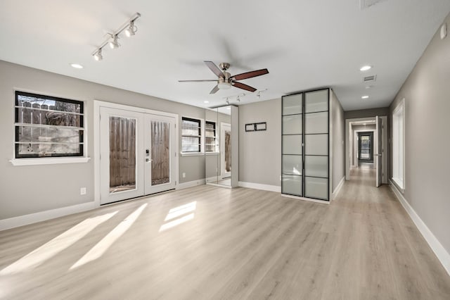 unfurnished room with light wood-type flooring, french doors, ceiling fan, and rail lighting