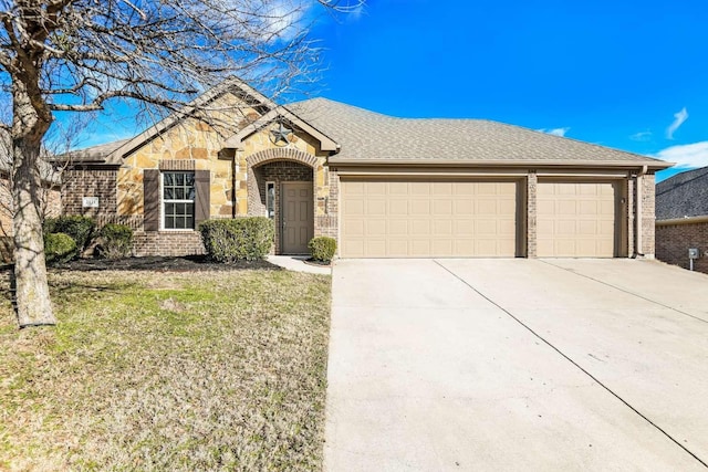 ranch-style house featuring a front lawn and a garage