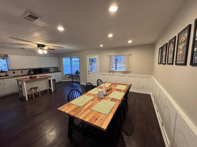 2732 Foxcroft Cir, Denton, TX 76209 - dining space featuring a decorative wall, dark wood-style flooring, recessed lighting, ceiling fan, and a wainscoted wall