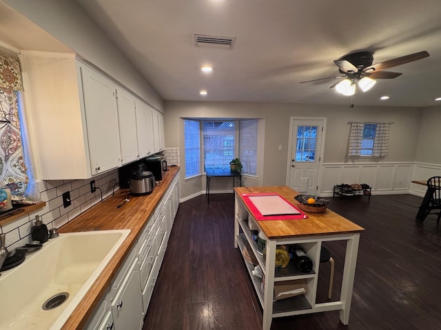 2732 Foxcroft Cir, Denton, TX 76209 - kitchen with wooden counters, a sink, white cabinetry, backsplash, and a ceiling fan