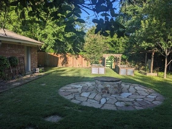 2732 Foxcroft Cir, Denton, TX 76209 - view of yard featuring an outdoor fire pit