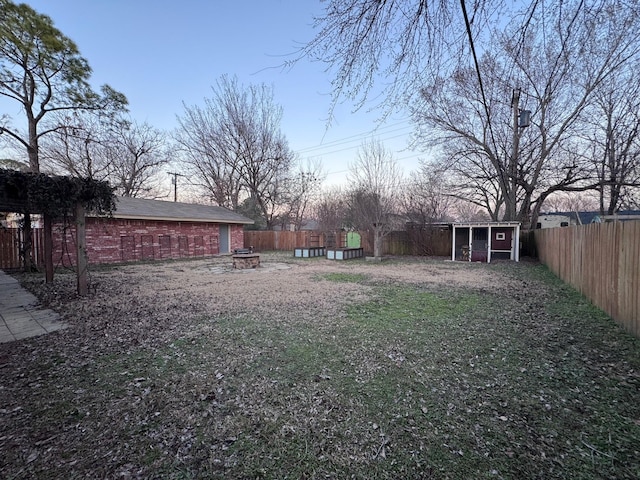 2732 Foxcroft Cir, Denton, TX 76209 - fenced backyard with an outbuilding and a storage shed