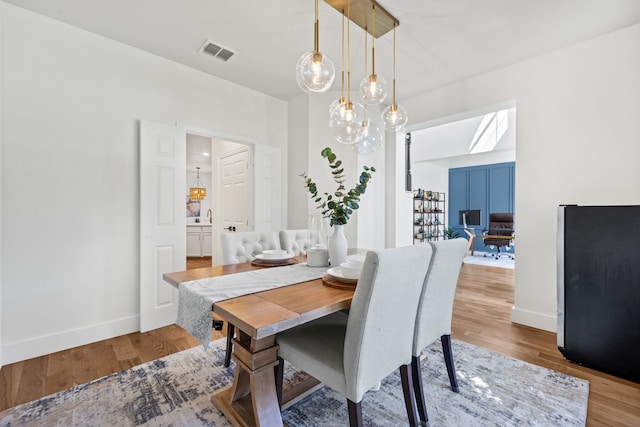 dining room with wood-type flooring