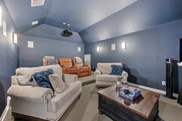 cinema with carpet floors, baseboards, visible vents, and vaulted ceiling