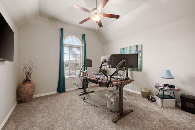 office area with lofted ceiling, baseboards, a ceiling fan, and light colored carpet