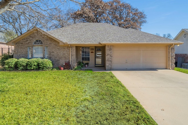 ranch-style home featuring a front yard and a garage