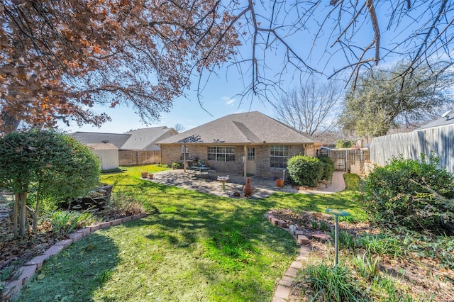 rear view of house with a patio area and a lawn