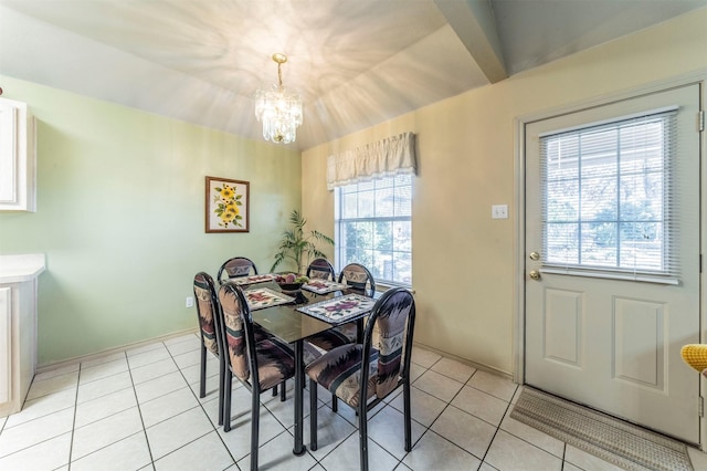 tiled dining area with a notable chandelier