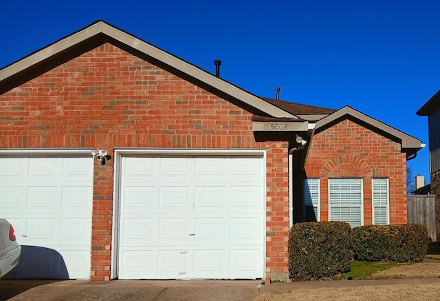 view of side of property featuring a garage