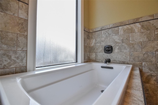 bathroom with tile walls and a washtub