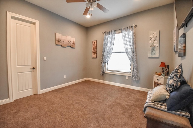 sitting room with carpet and ceiling fan