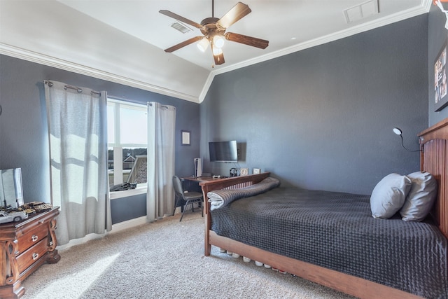 bedroom featuring lofted ceiling, visible vents, crown molding, and light carpet