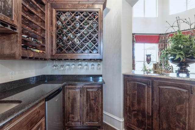 bar featuring a bar and dishwasher