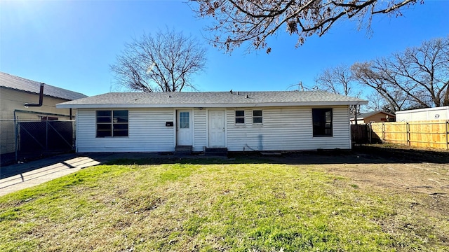 back of house featuring a yard