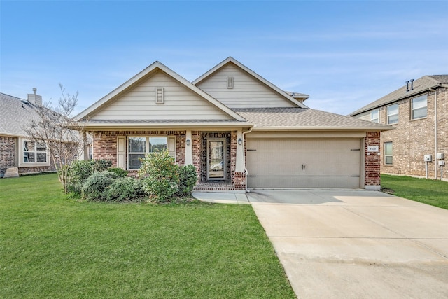 view of front of home with a front yard and a garage