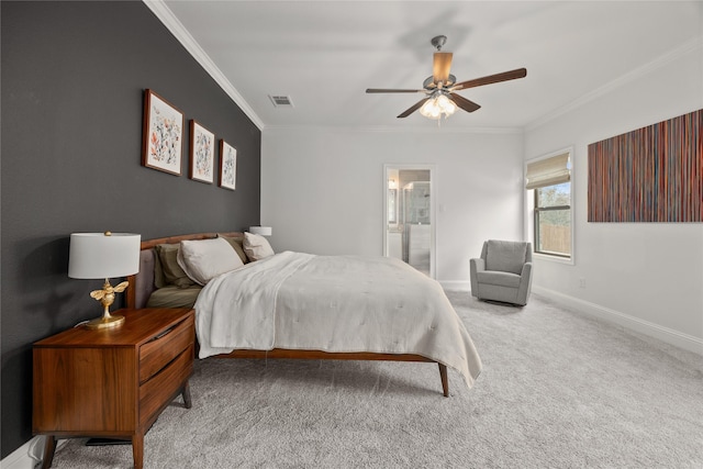 carpeted bedroom with visible vents, ornamental molding, a ceiling fan, ensuite bath, and baseboards