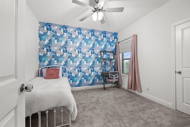 carpeted bedroom featuring a ceiling fan and baseboards