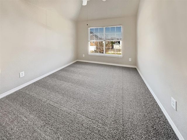 unfurnished room with carpet and lofted ceiling