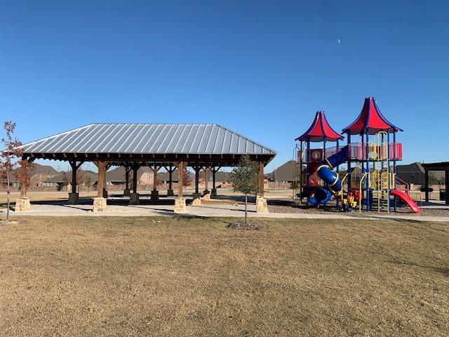 view of play area featuring a lawn