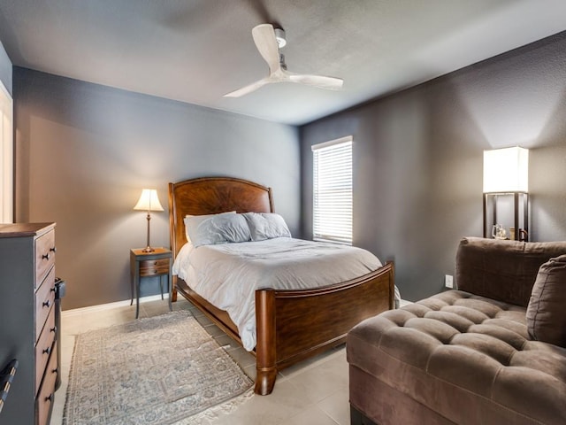 tiled bedroom with ceiling fan