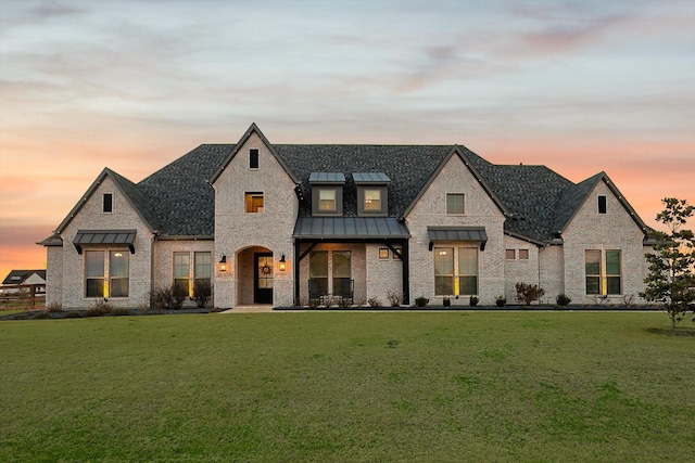 view of front of house with a yard