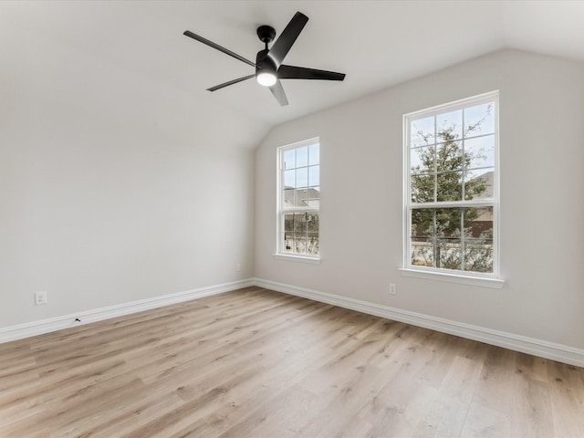 spare room with ceiling fan, light hardwood / wood-style floors, and lofted ceiling