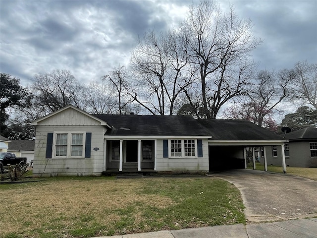 single story home with a front yard and a carport