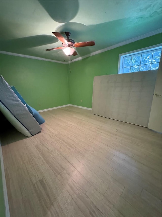 unfurnished bedroom featuring ceiling fan, ornamental molding, and light hardwood / wood-style floors