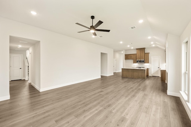 112 Woodlands Way, Balch Springs, TX 75181 - unfurnished living room with lofted ceiling, ceiling fan, wood finished floors, baseboards, and recessed lighting