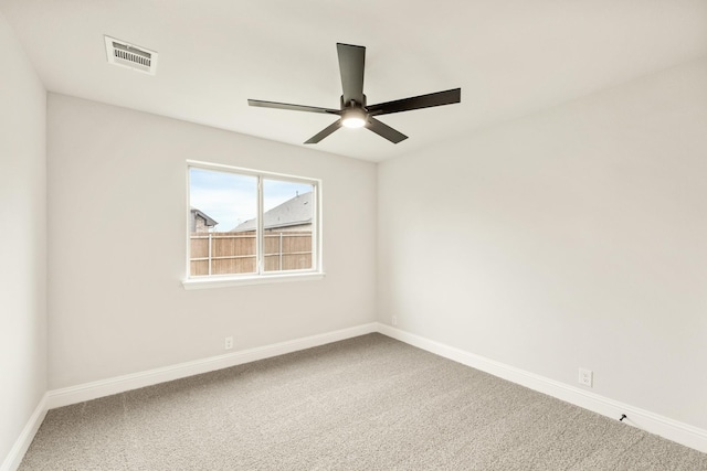 112 Woodlands Way, Balch Springs, TX 75181 - spare room featuring carpet floors, a ceiling fan, and baseboards