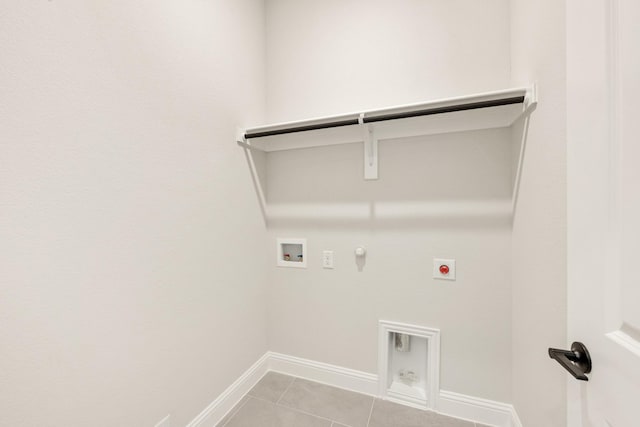 112 Woodlands Way, Balch Springs, TX 75181 - clothes washing area featuring gas dryer hookup, electric dryer hookup, washer hookup, light tile patterned flooring, and baseboards