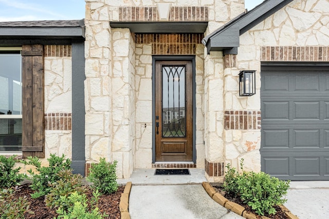 112 Woodlands Way, Balch Springs, TX 75181 - property entrance with stone siding and a garage