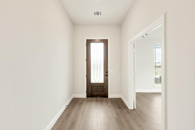 112 Woodlands Way, Balch Springs, TX 75181 - entrance foyer with light wood-style flooring, plenty of natural light, and baseboards