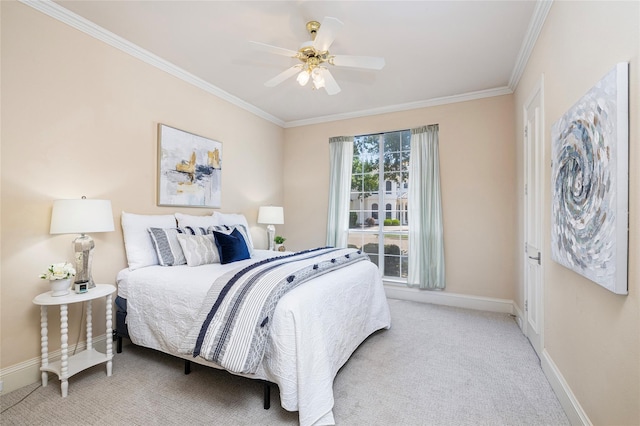 carpeted bedroom featuring ceiling fan and crown molding