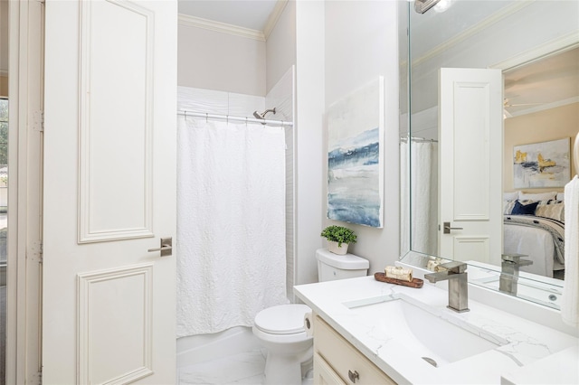 bathroom with vanity, crown molding, and toilet