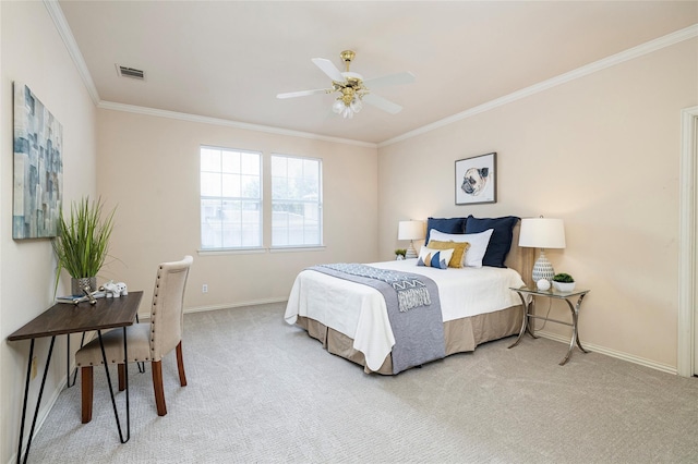 carpeted bedroom with ceiling fan and ornamental molding