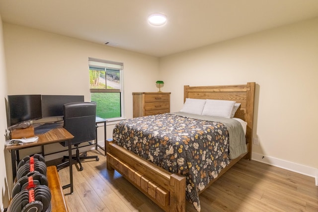 2040 Bluff Creek Dr, Strawn, TX 76475 - bedroom featuring baseboards, visible vents, and light wood-type flooring
