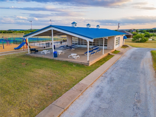2040 Bluff Creek Dr, Strawn, TX 76475 - exterior space with a lawn, a patio area, fence, and playground community